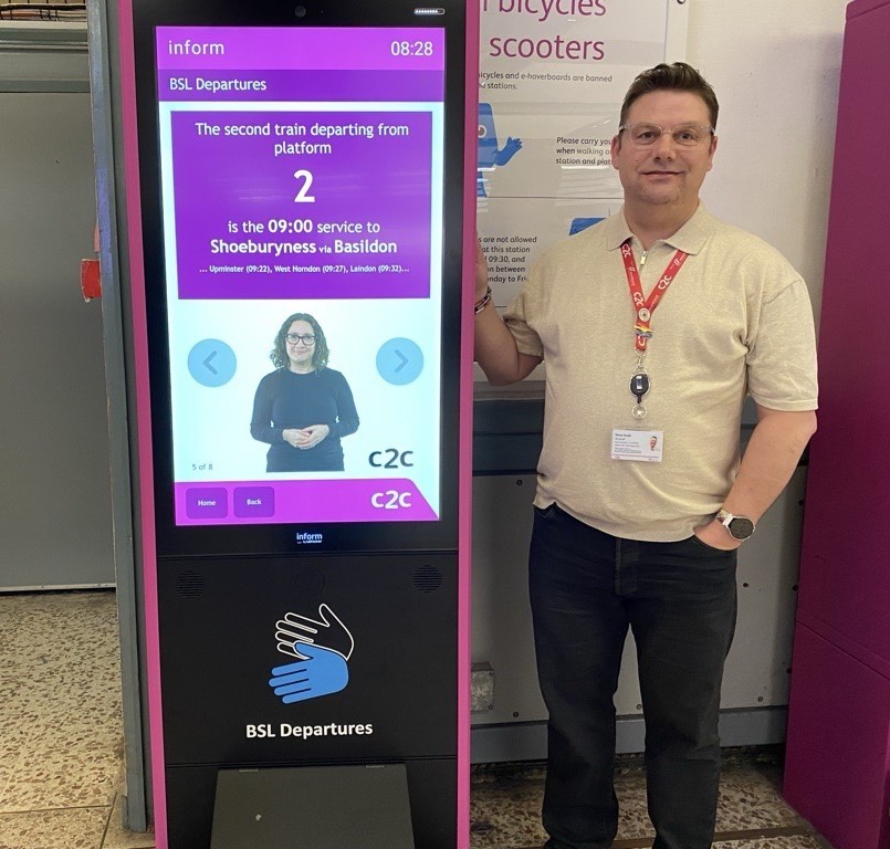  67ee476c78aa2 67ee476c78aa3c2c Accessibility And Integrated Travel Manager, Steve Scutt, Poses Alongside The New British Sign Language (bsl) Screen.jpg